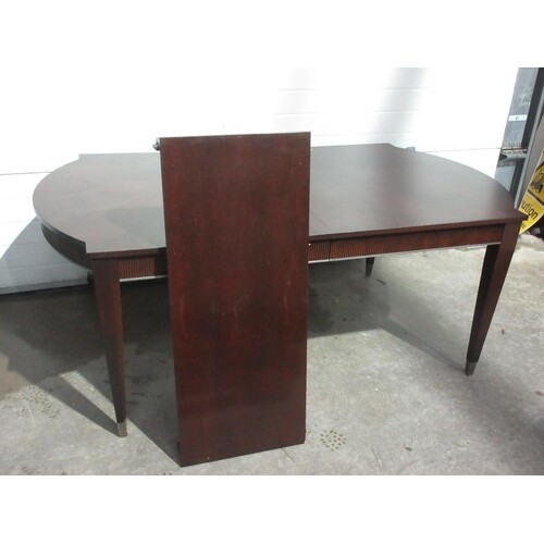 A reproduction mahogany extending Dining Table mounted upon ...