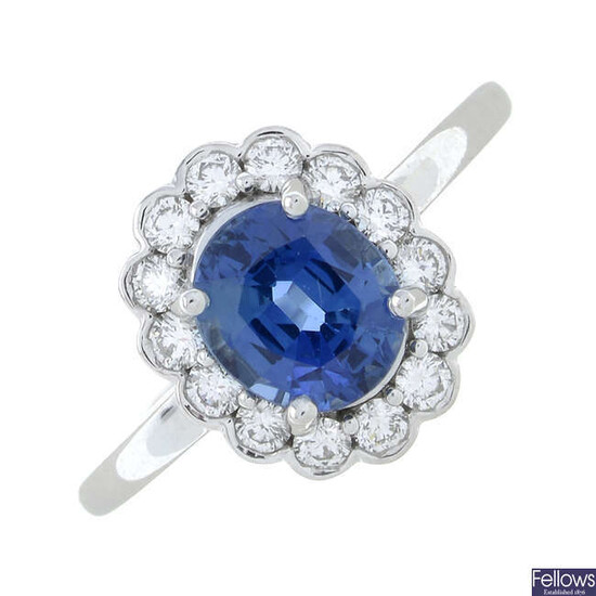 A sapphire and diamond cluster ring.