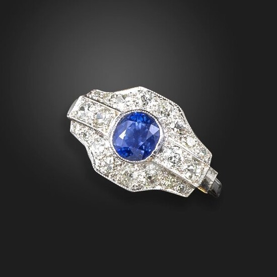 A sapphire and diamond dress ring, set with an oval-shaped...
