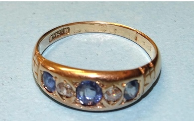 A sapphire and diamond gipsy ring set three sapphires and tw...