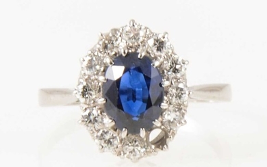 A sapphire and diamond oval cluster ring.