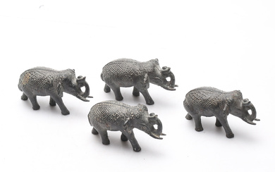 A set of four oriental elephants, bronze patinated metal.