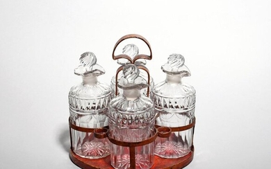 A set of four small cut glass spirit decanters and...