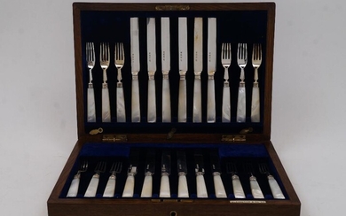 A set of mother of pearl-handled silver fruit eaters, Birmingham, 1921, Elkington & Co Ltd, comprising twelve knives and twelve forks, in fitted oak case