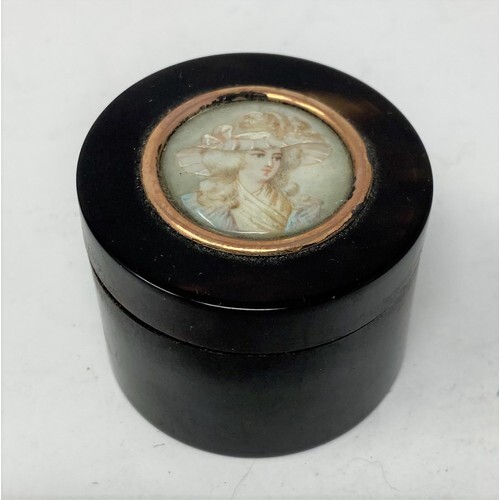 A tortoiseshell circular box and cover, the top inset a circ...