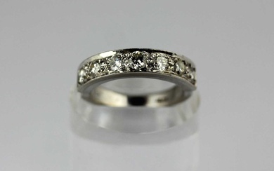 A white gold and diamond seven stone half eternity ring