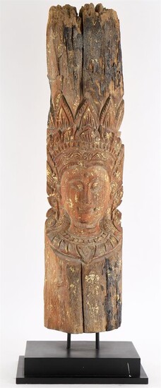 A wood head of Buddha in relief