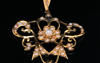 AN ANTIQUE ART NOUVEAU 15ct GOLD AND SEED PEARL. DROP LENGTH INCLUDING BAIL 4.4cms.