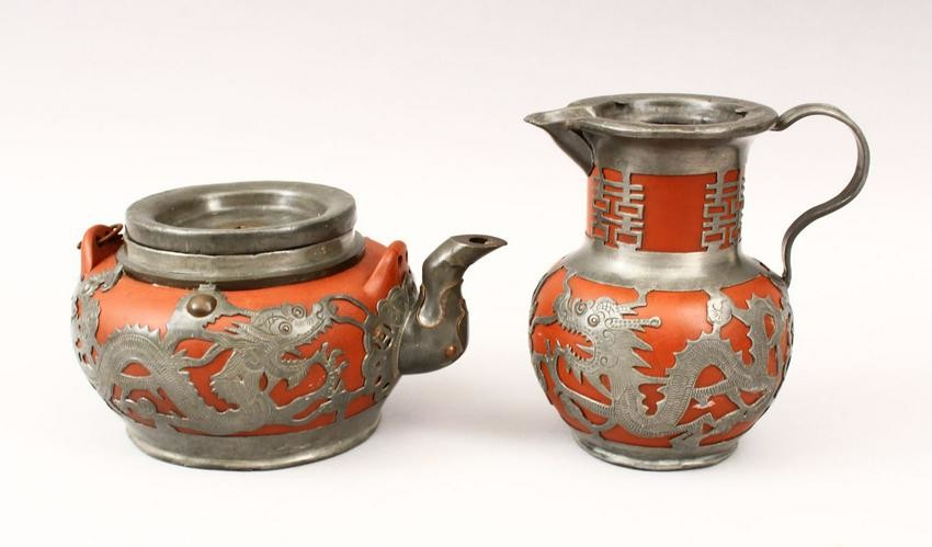 AN EARLY 20TH CENTURY CHINESE YIXING WHITE METAL TEAPOT