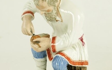AN EARLY 20TH CENTURY RUSSIAN PORCELAIN FIGURE