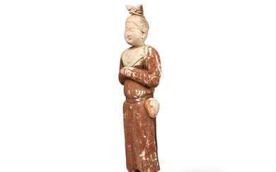 AN UNUSUAL PAINTED POTTERY FIGURE OF AN ATTENDANT Tang dynasty...