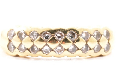 An 18 carat yellow gold half hoop ring set with two rows of diamonds.