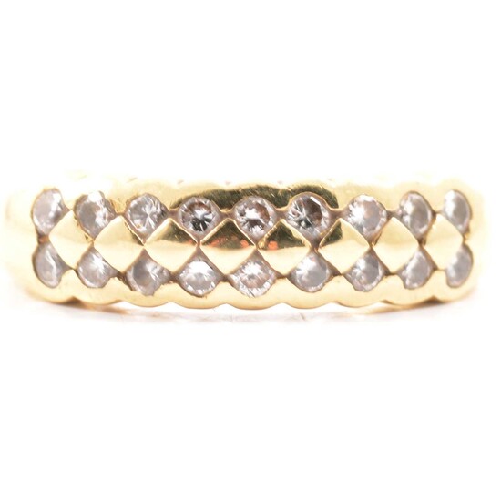 An 18 carat yellow gold half hoop ring set with two rows of diamonds.