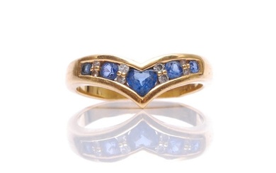 An 18ct sapphire and diamond wishbone ring with central hear...