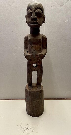 NOT SOLD. An African figure of carved wood. 20th century H. 65 cm. – Bruun Rasmussen Auctioneers of Fine Art