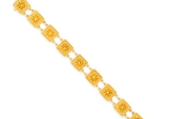 An Archaeological Revival fifteen karat gold bracelet