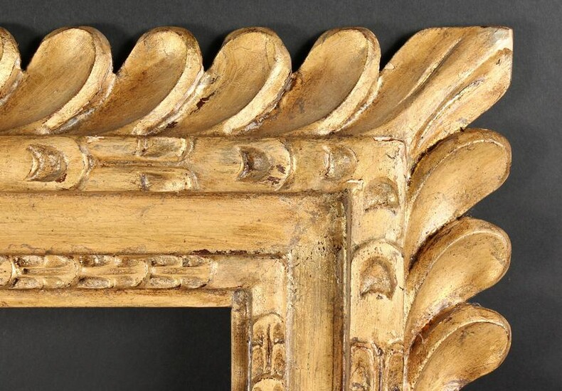 An Early 20th Century Carved Wood Frame with a Heavy