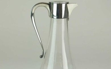 An Edwardian silver mounted glass claret jug