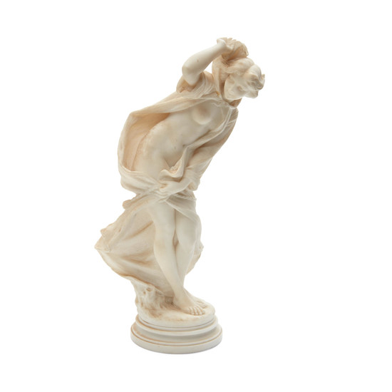 An Italian Carved Marble Figure of a Nude Maiden in a Windblown Cape