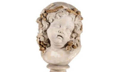 An Italian plaster bust of a cherub