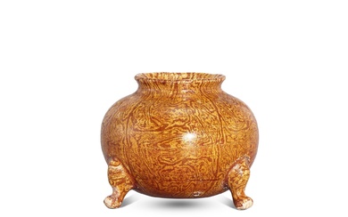 An amber-glazed marbled tripod jar, Tang dynasty 唐 琥珀釉絞胎三足鬲