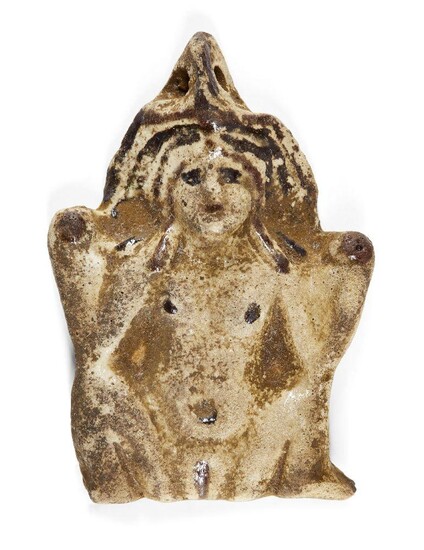 An ancient Egyptian white faience amulet of the Greco-Egyptian goddess Baubo, circa 1st century AD, the female deity portrayed nude in her usual stance, squatting, with legs a part, and her hands indicating her genitals, the reverse flat and...