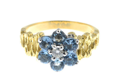 An aquamarine and diamond floral cluster ring.