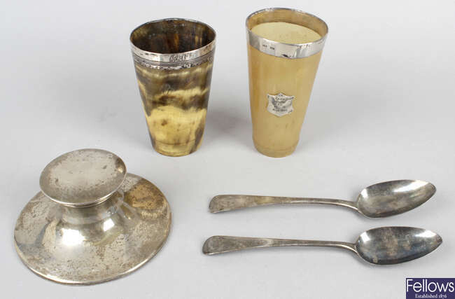 An assortment of silver items, to include a silver capstan inkstand, two Georgian spoons, etc.