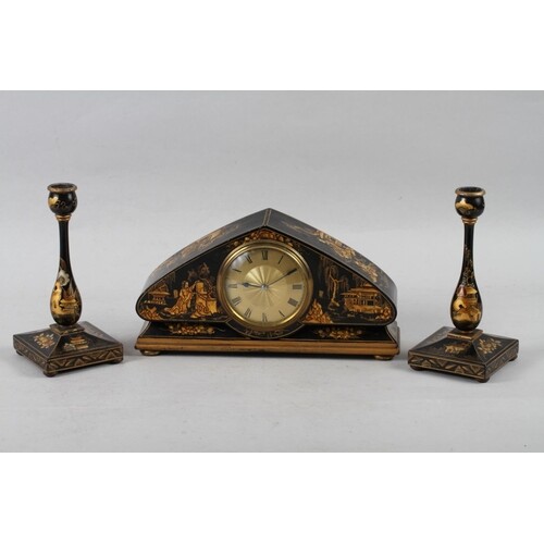 An early 20th century arch top mantel clock, in black and gi...