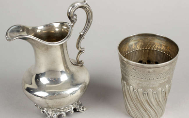 An early Victorian silver cream jug & a late Victorian silver beaker. (2).