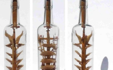 An intricate bottle whimsy containing 12 carved fans