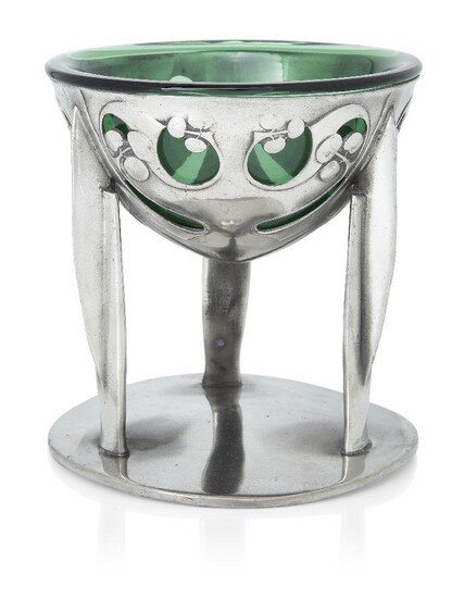 Archibald Knox (1864-1933) for Liberty & Co, Tudric comport with green glass liner, model no.0276, circa 1905, Pewter and glass, Stamped '2/ENGLISH PEWTER/0276/MADE/IN/ENGLAND', 13.5cm high Literature Mervyn Levy, Liberty Style; The Classic Years...
