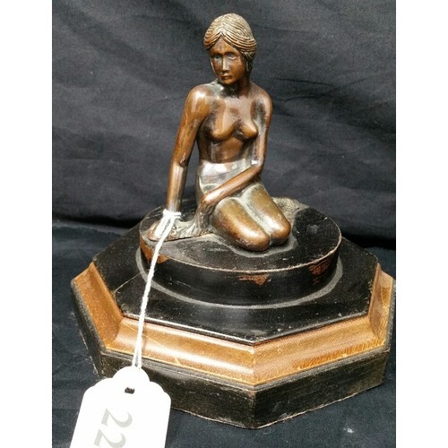 Art deco bronze effect figure on a part ebonized wooden base...