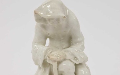 Bow white glazed porcelain figure of a man before a brazier emblematic of winter, probably Longton Hall