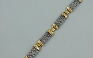Bracelet en acier et or jaune 14k dans le... - Lot 23 - Copages Auction Paris