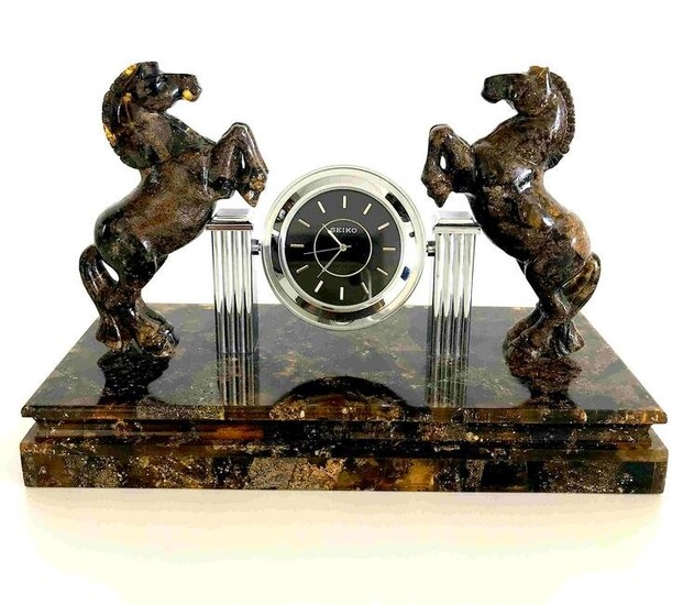 Collectible Baltic amber clock with hand carved horses