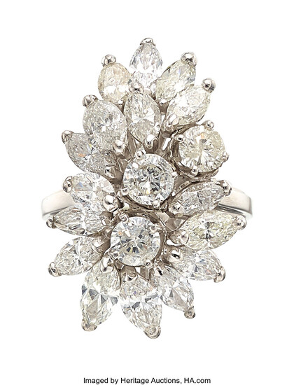 Diamond, White Gold Ring The ring features marquise-shaped diamonds...