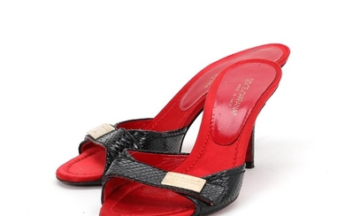 Dolce & Gabbana A pair of stilettos of black snakeskin with red...