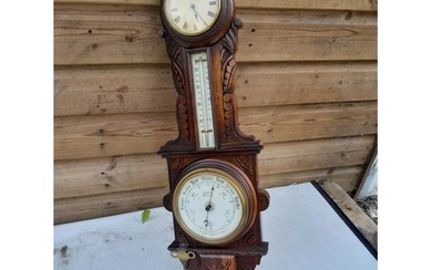 Early 20th century carved oak case barometer with thermomete...