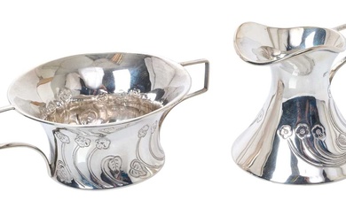 Edwardian Art Nouveau silver milk jug and sugar bowl, each with stylised floral decoration