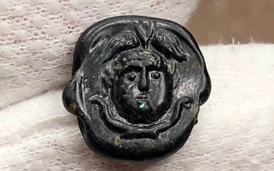 Excellent Ancient RomanGlass Central Bead with an image of Medusa (Gorgona) wearing a wigned had,two snakes below.