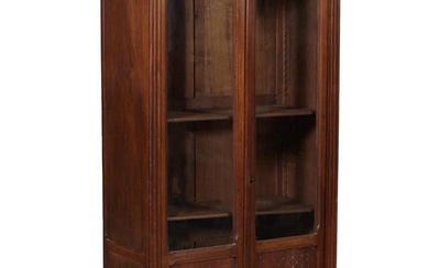 French Napoleon III Style Carved Walnut Bookcase, early 20th c., the restrained flat stepped top