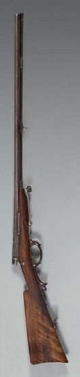 Shotgun system Dreyse, central percussion by needle, double barrel in damascus steel table with tobacco-coloured ribbon swivelling on the right side by means of a lever under the barrel and arming the strikers, signed on the band in silver letters: "N...