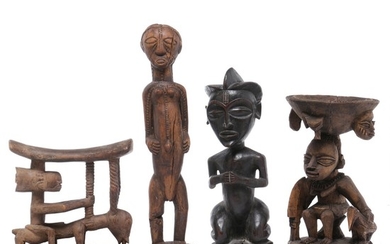 Headrest, bowl and two ancestor figures of carved patinated wood. Yoruba, Luba and Chokwe style. H. 19–40 cm. (4)