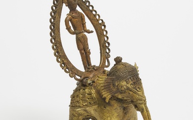 Indian Gilt Dhokra Model of an Elephant and Deity Rider Standing Within a Holy Prabha, early-mid 20th century