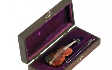 Miniature violin model in its own case.