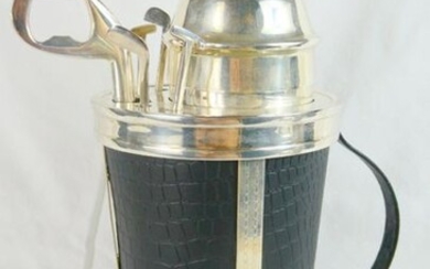 Novelty Silver Plated and Leather Cocktail Shaker as a golf bag with cork screw, bottle opener and stirrer accessories as golf clubs. Circa 1990. Height 30.4cm.