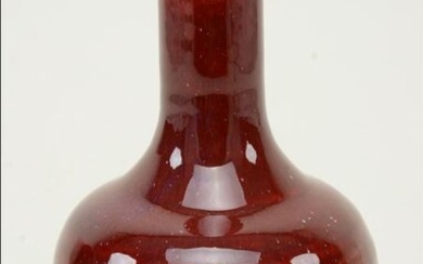 Oxblood bottle vase. China. 19/20th century. Flambe