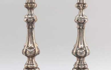 PAIR OF BAROQUE-STYLE SILVER PLATED CANDLESTICKS Unmarked. Heights 14.5".
