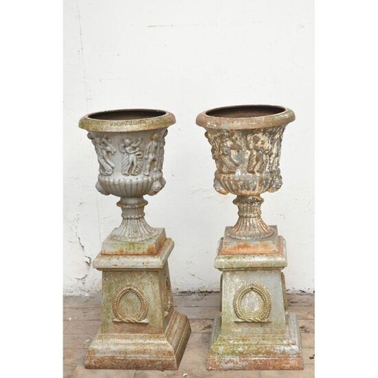 PAIR OF CAST IRON MEDICINAL VASES presented on...